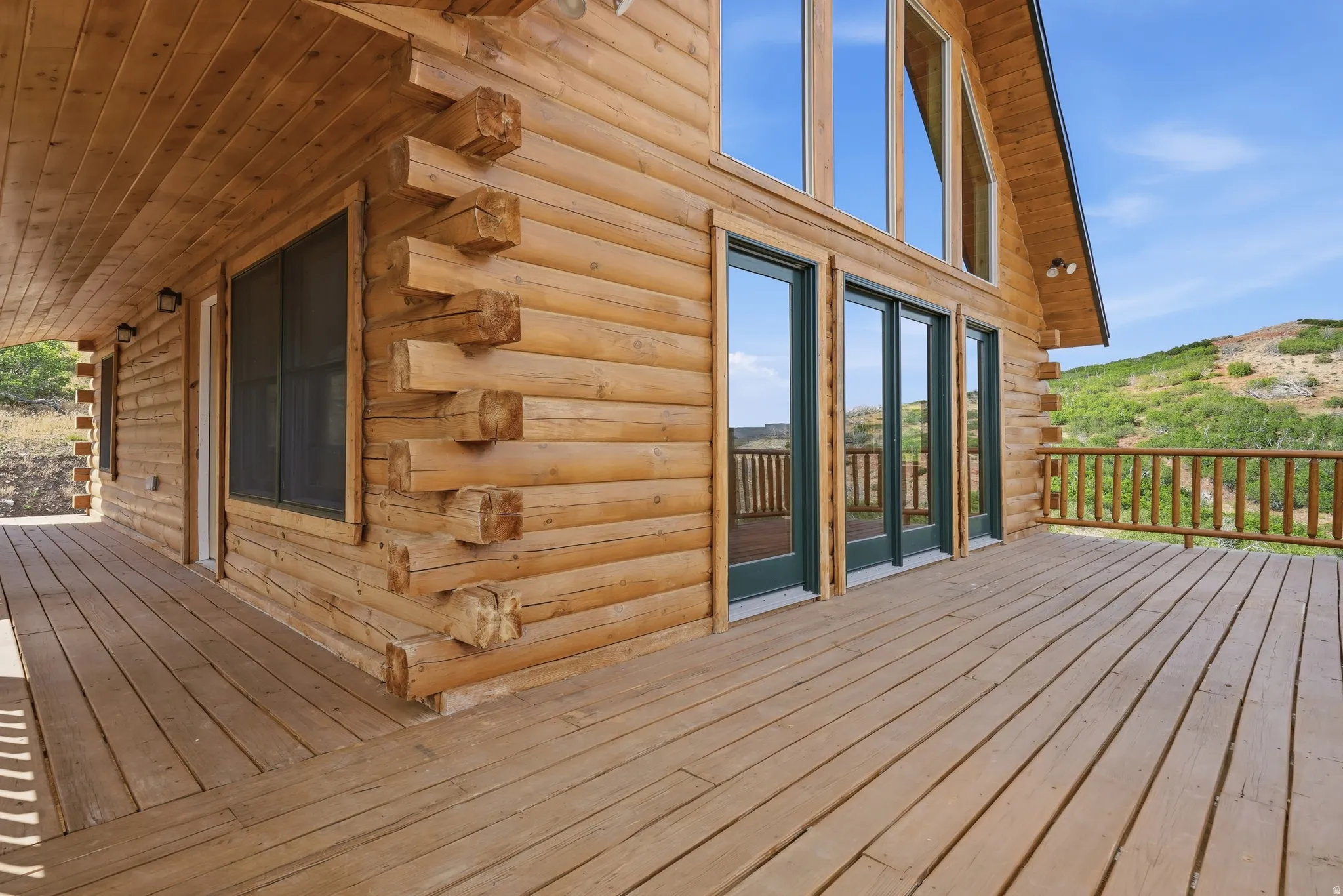 Expansive wood deck with a natural wood railing