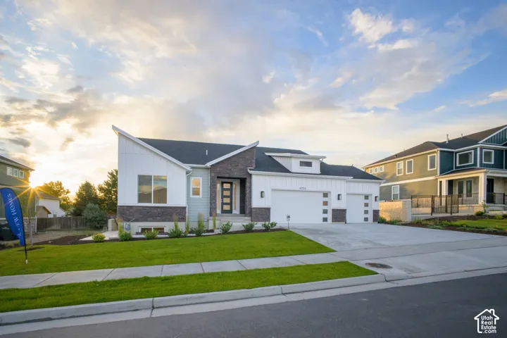 Contemporary residence featuring a striking architectural design with a prominent angled roofline