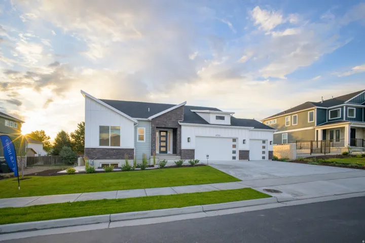 Contemporary residence featuring a striking architectural design with a prominent angled roofline