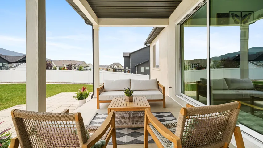 Covered patio featuring a solid roof and recessed lighting