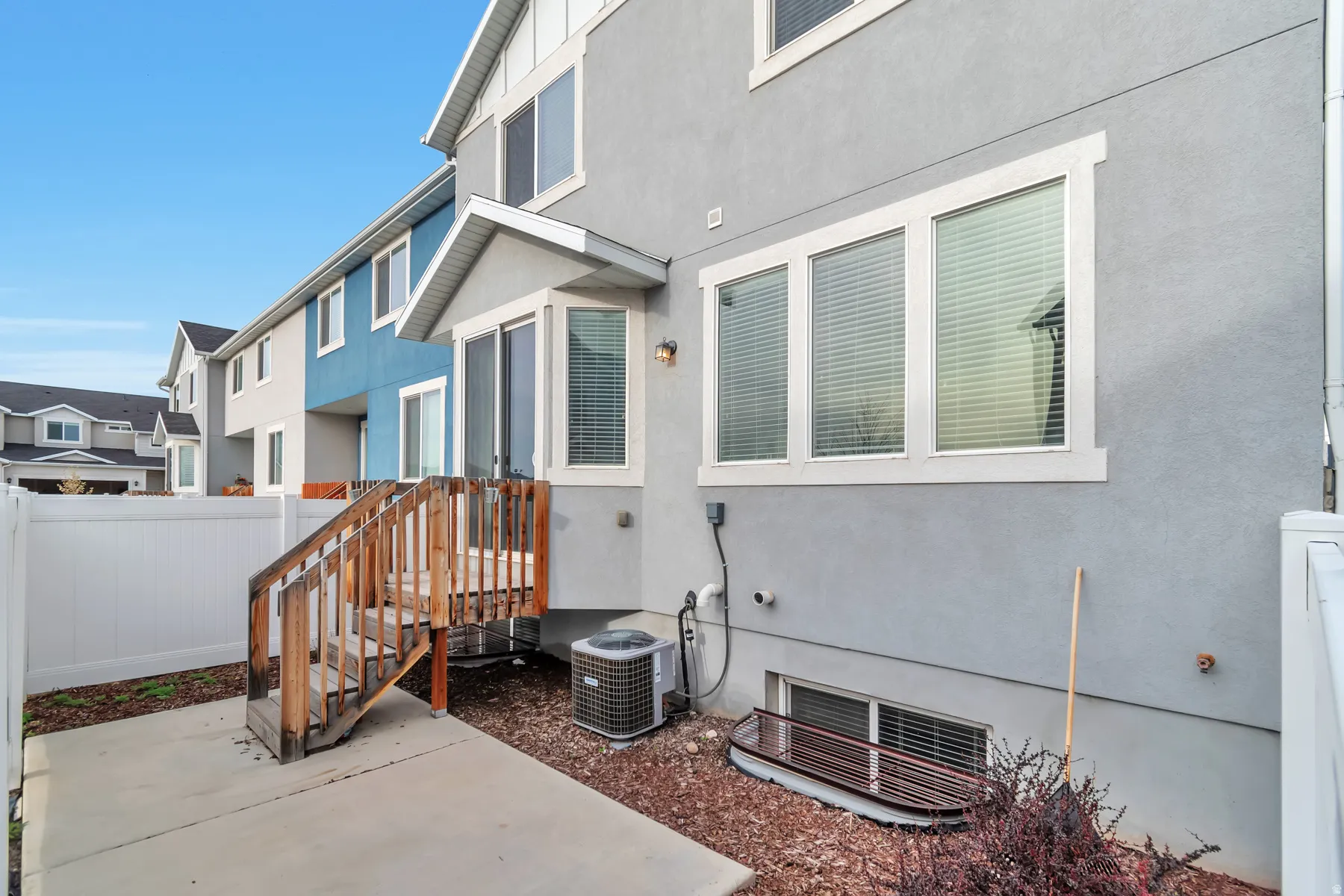 Private patio area with concrete and gravel surfaces