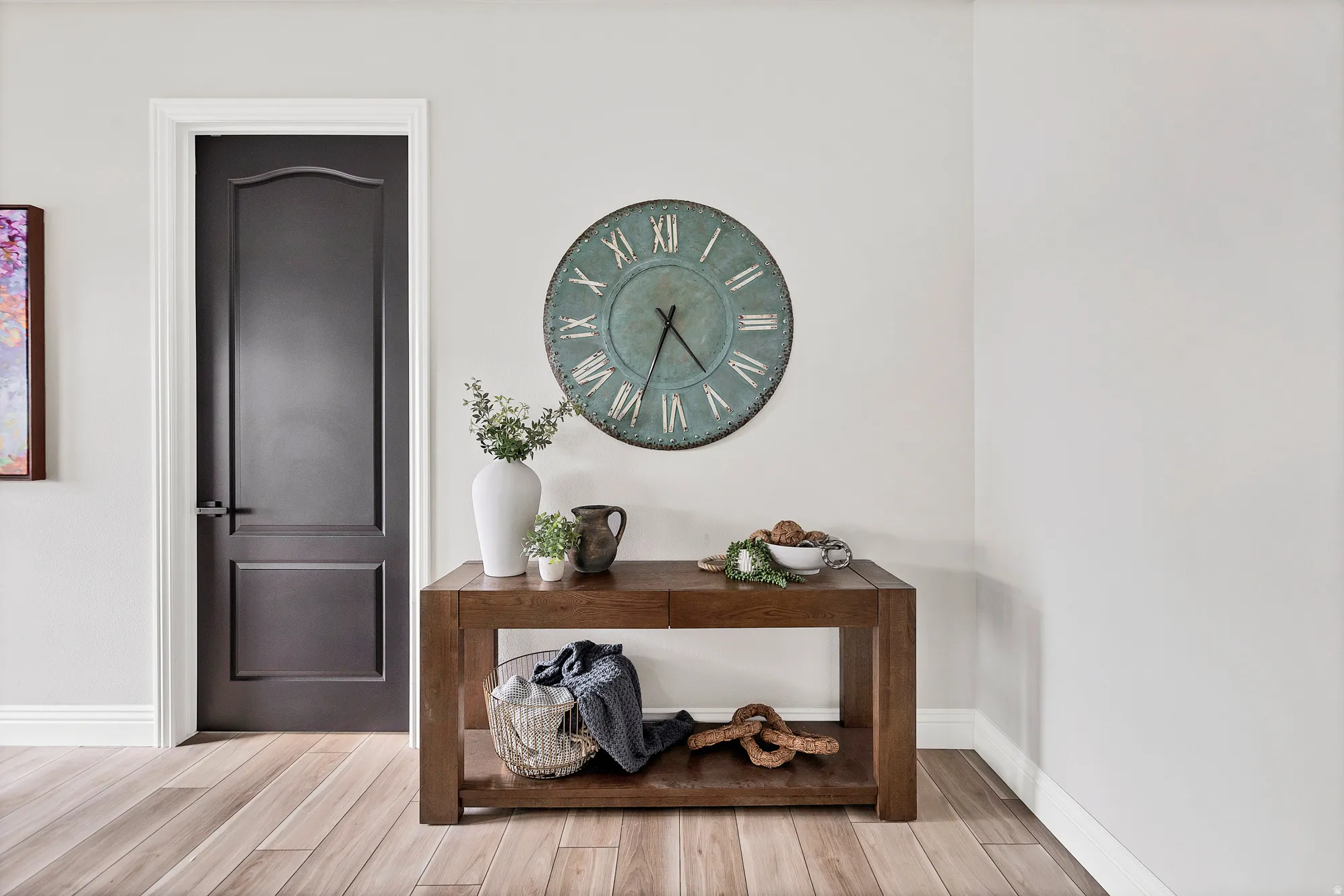 Neutral wall paint complementing light wood-finish flooring