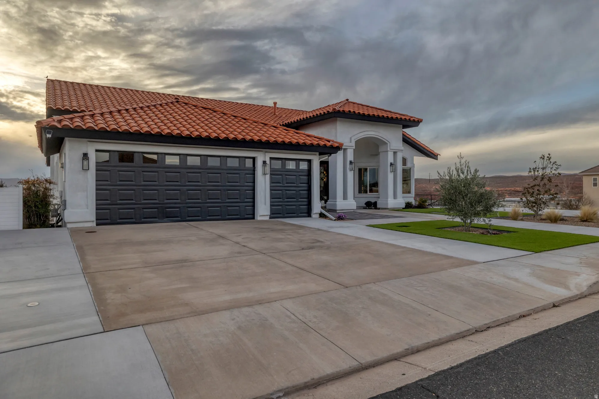 Stucco exterior with a terracotta tile roof