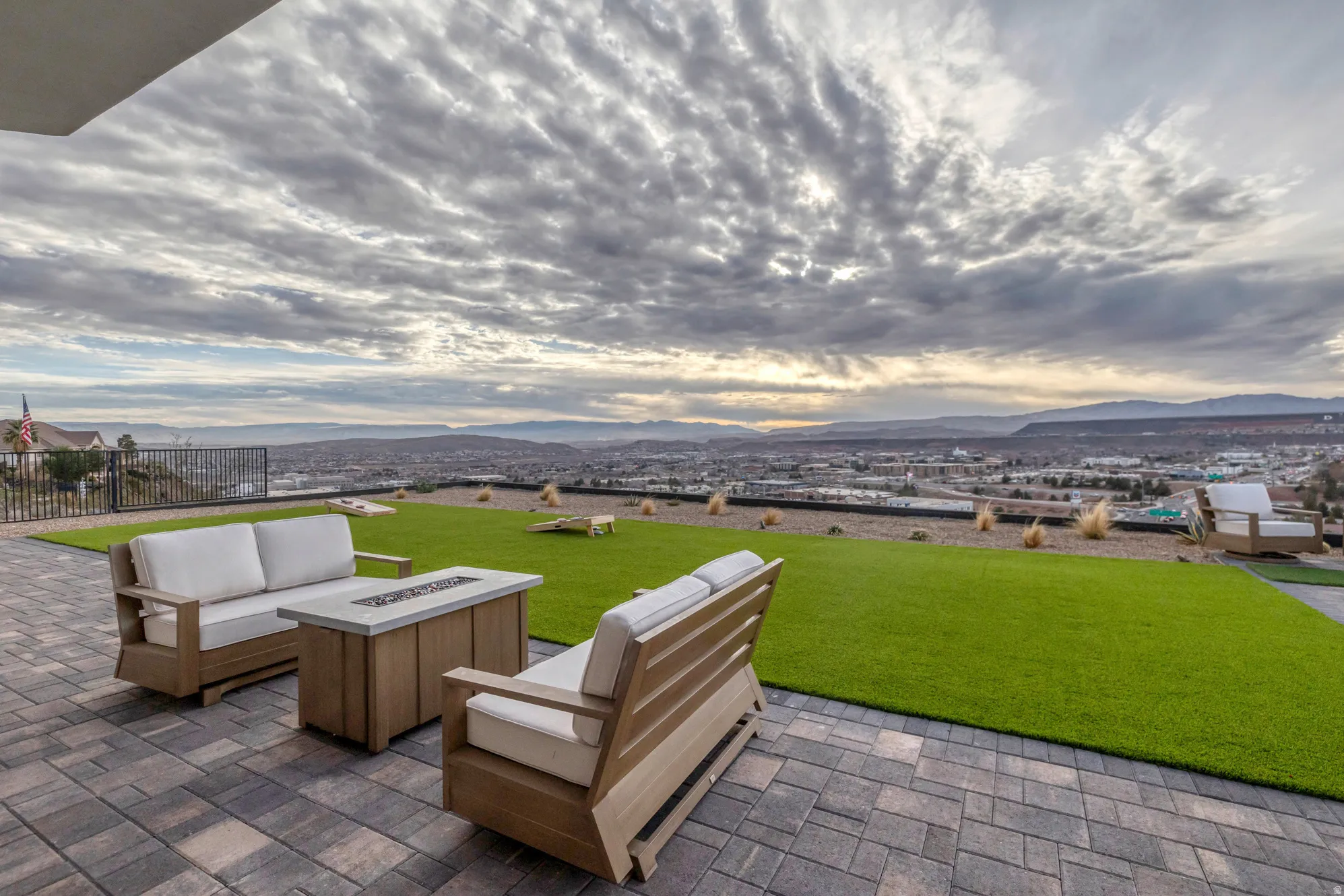 Expansive paver patio with fire pit feature