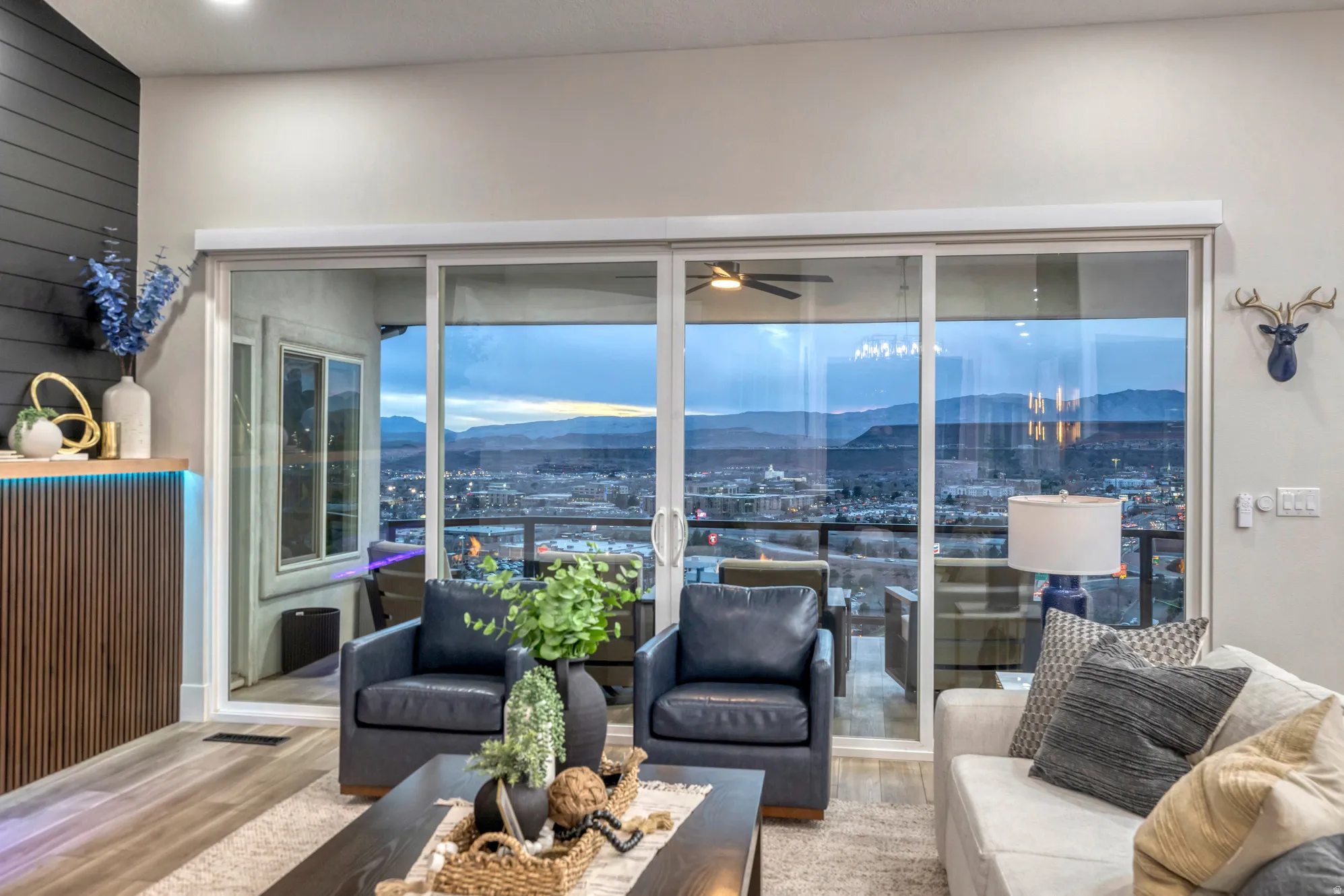 Sliding glass doors opening to an exterior area with mountain scenery