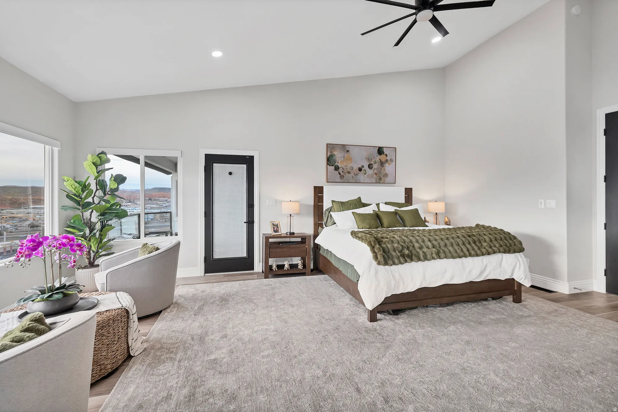 Spacious room featuring vaulted ceilings, recessed lighting, and a contemporary ceiling fan