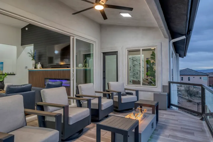 Outdoor living space featuring a ceiling fan, recessed lighting, and wood-finish flooring