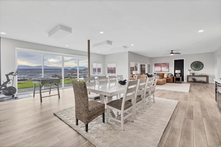 Open-concept interior featuring wood-finish flooring and recessed lighting