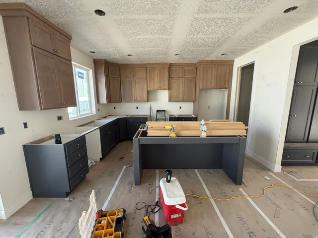 Kitchen featuring two-tone cabinetry, recessed lighting, and a center island