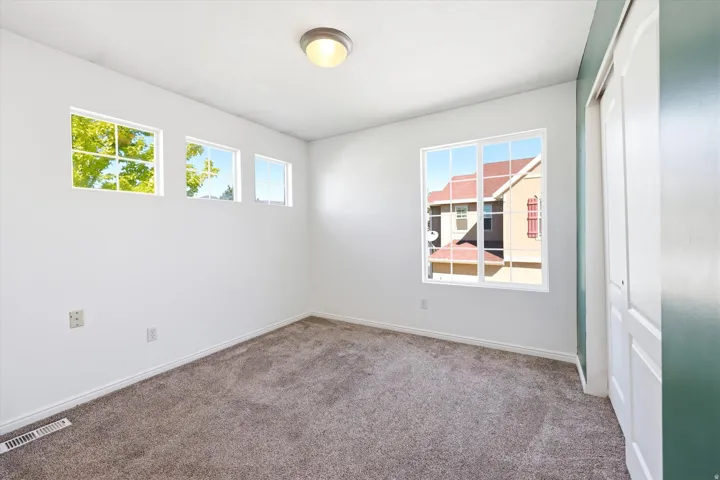 Neutral-toned carpeting paired with white walls