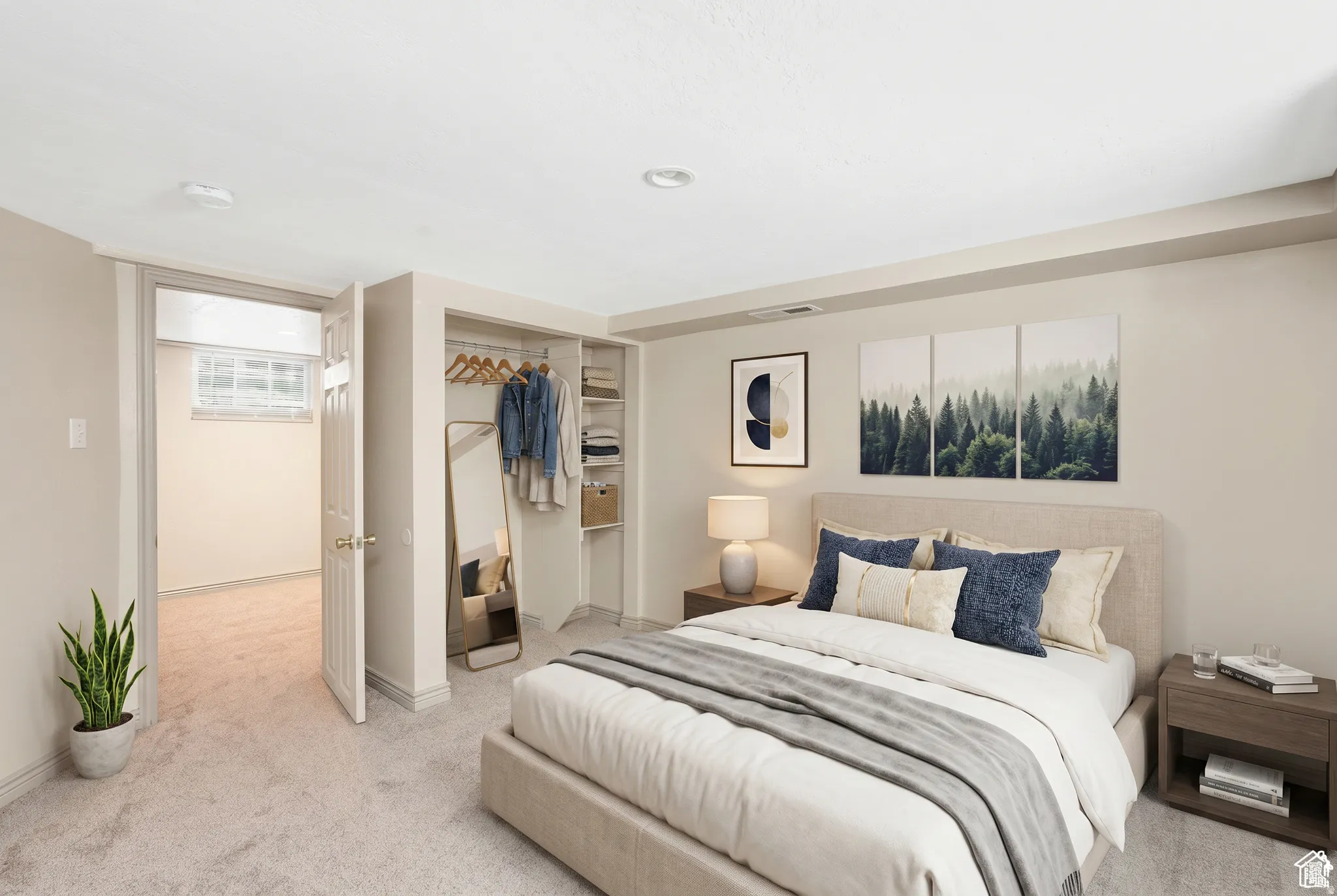 Carpeted bedroom featuring recessed lighting, a built-in closet with shelving and hanging space, and a white interior door