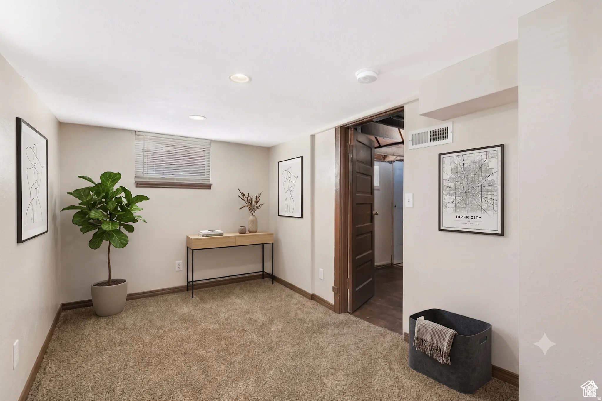 Carpeted room with recessed lighting and a single window featuring blinds