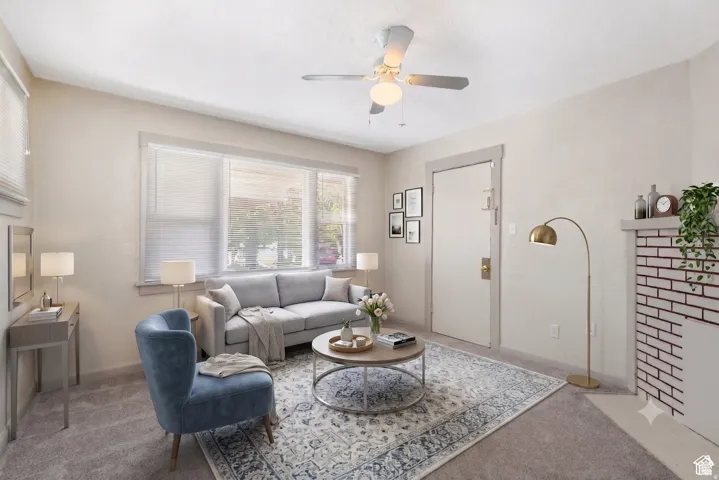 Living room featuring light-colored wall paint and carpet flooring