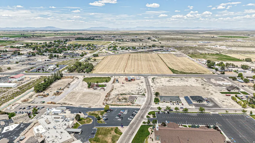 Expansive aerial perspective showcasing a significant land parcel with visible development potential