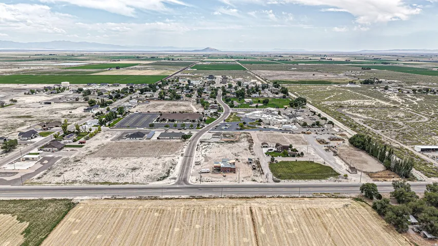 Expansive aerial view showcasing multiple land parcels and established community infrastructure