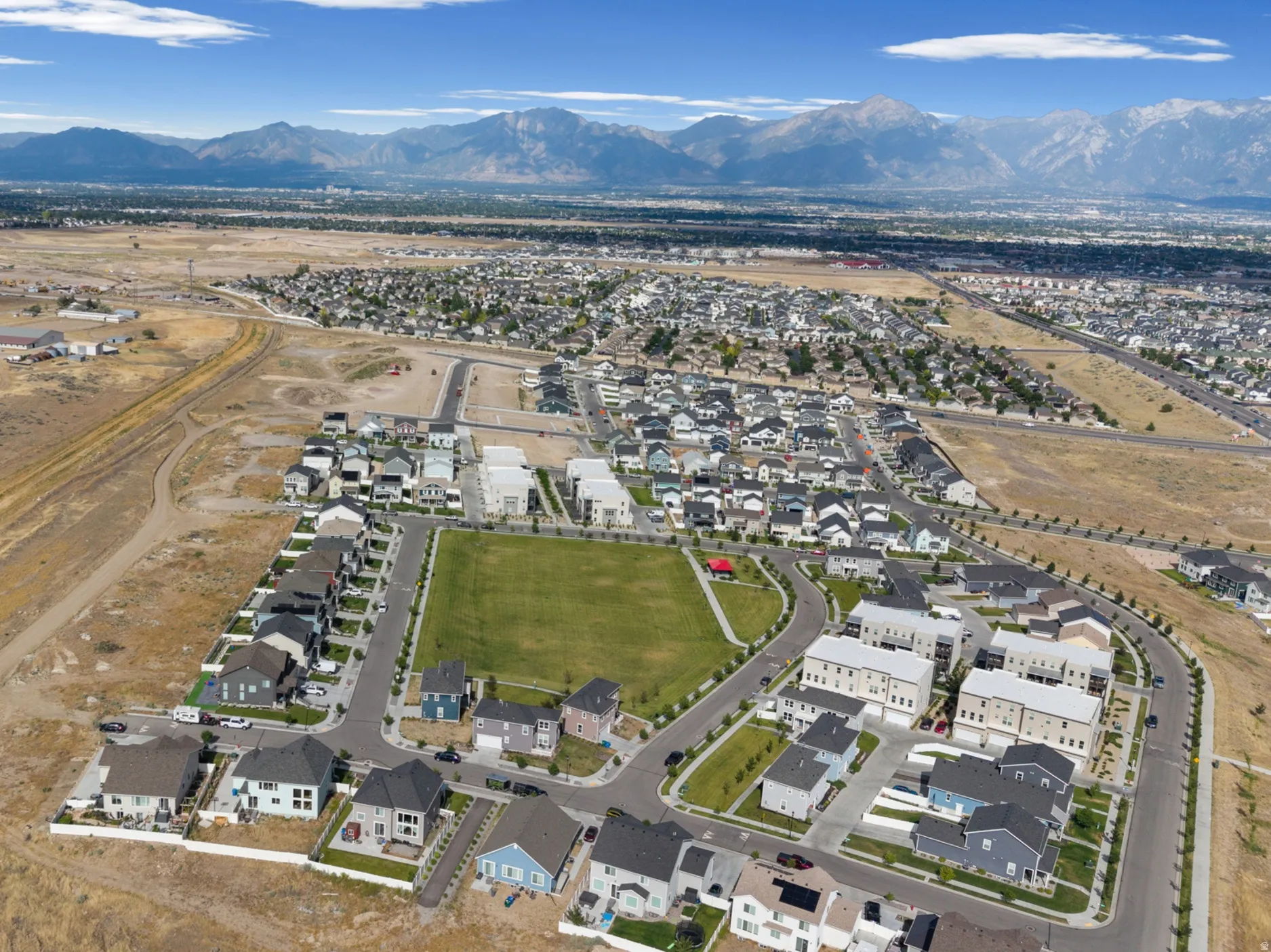 Aerial perspective showcasing a developing residential area with diverse housing styles