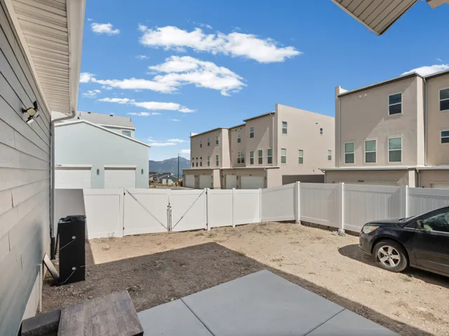 Private fenced yard with concrete patio
