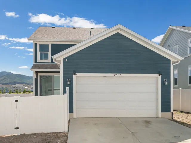 Two-story residence featuring a blue siding exterior with white trim accents