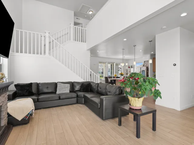 Open concept living area with wood-finish flooring