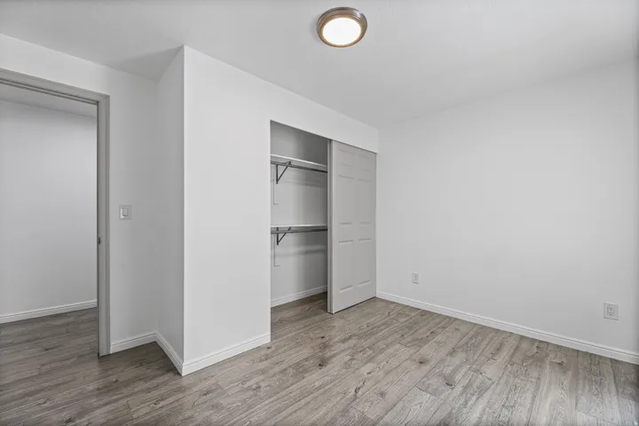 Additional angle highlighting the bedroom's closet storage and bright, versatile living space.