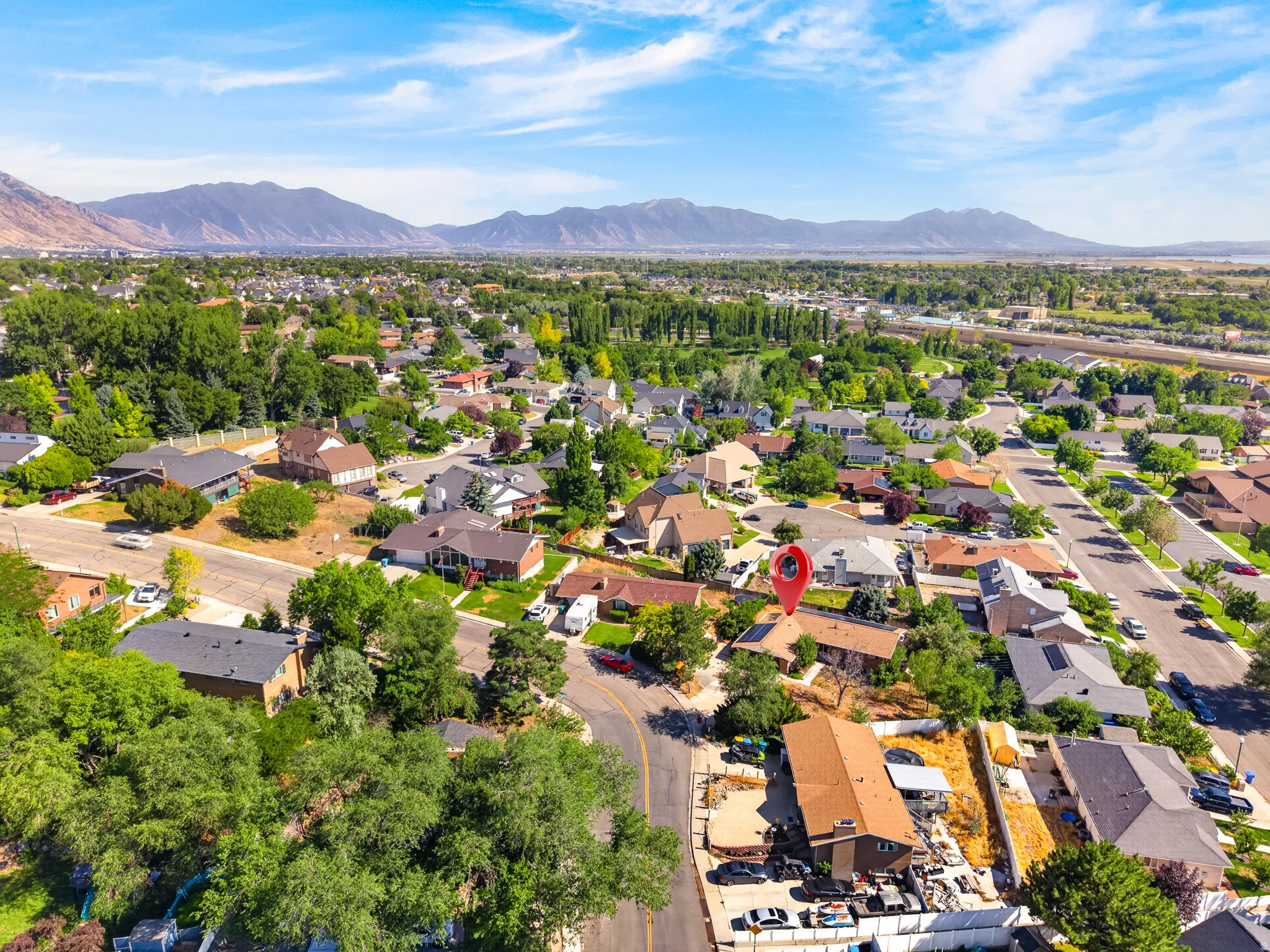Aerial perspective showcasing a residential area with varied home styles and mature landscaping