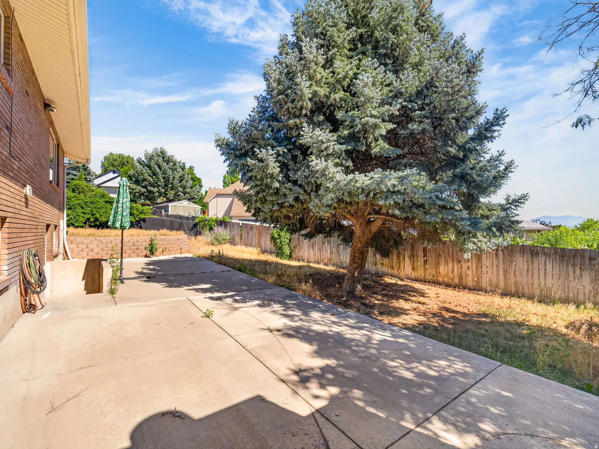 Expansive concrete patio area offering significant outdoor space