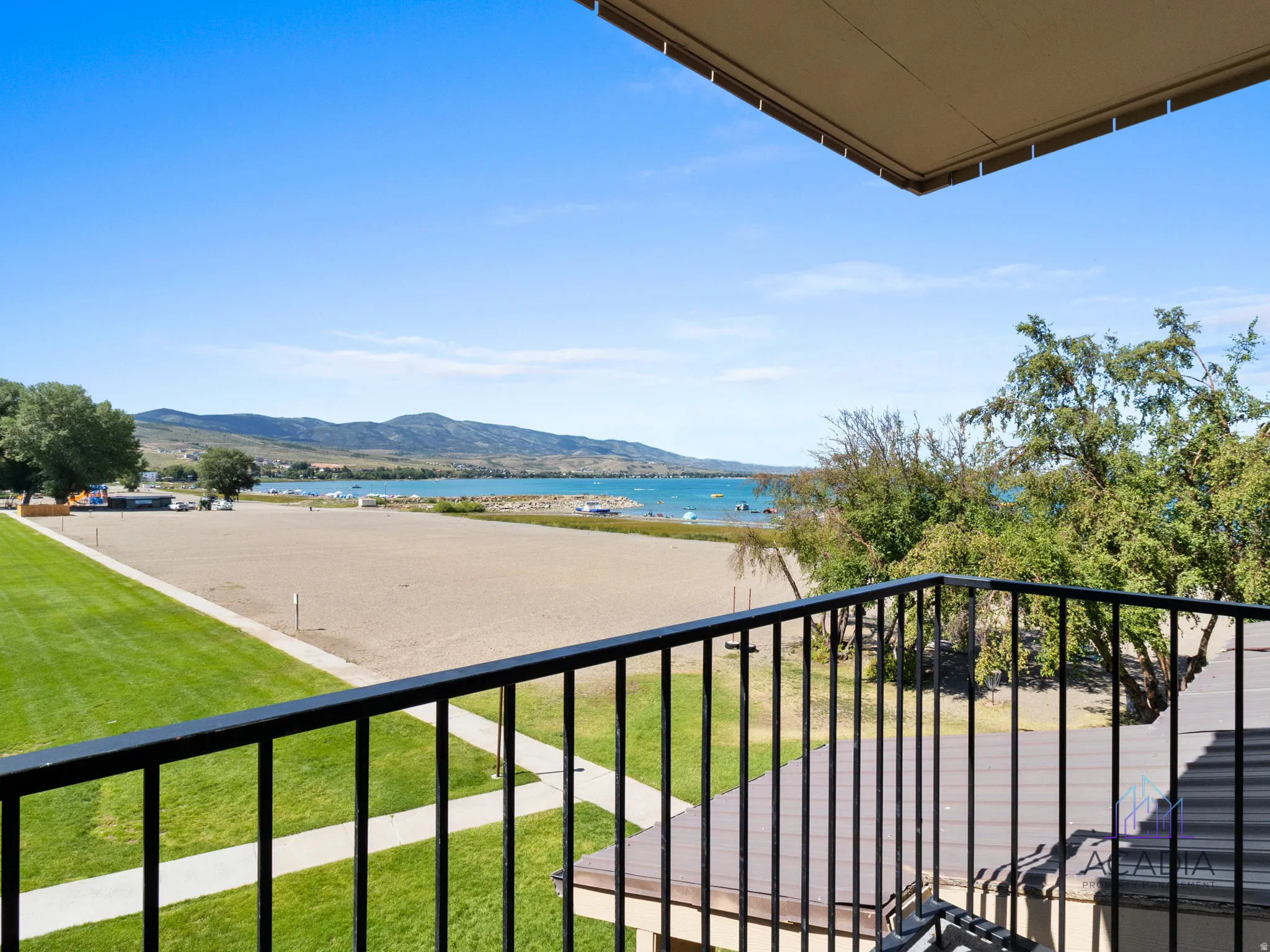Balcony featuring black metal railings and a clear sky overhead