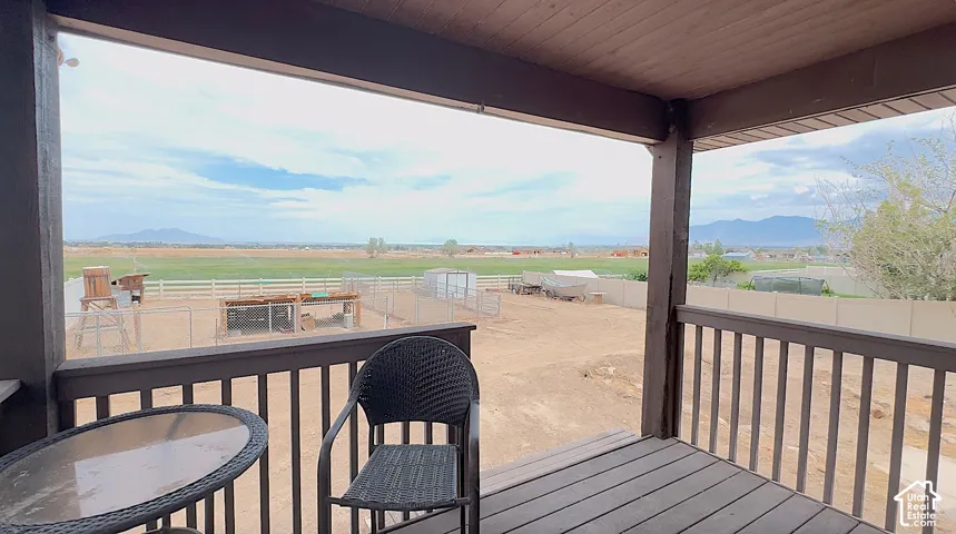 Covered balcony with TREX flooring and railing with a beautiful view of the valley.