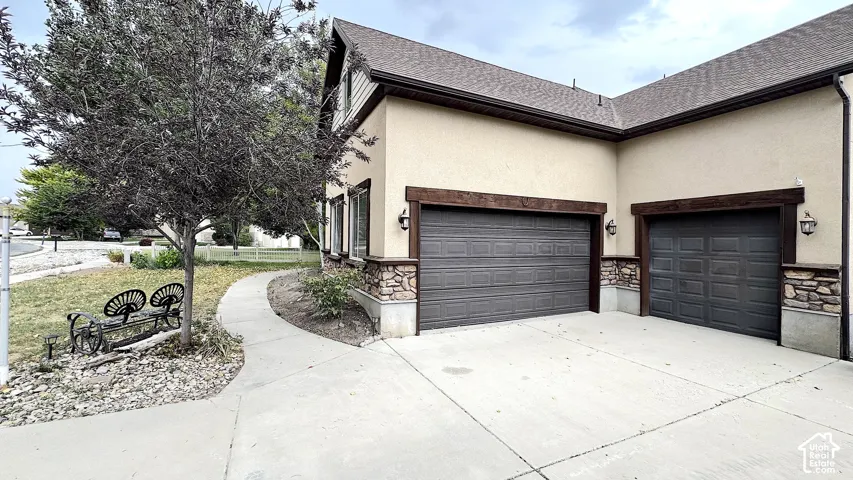 Spacious 3 Car Garage with room for RV Parking just to the right.