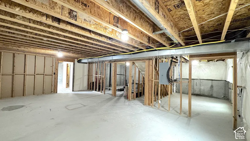 Unfinished Basement with set up for a bonus room, 2 bedrooms, living room and bath with Walk-Out access.