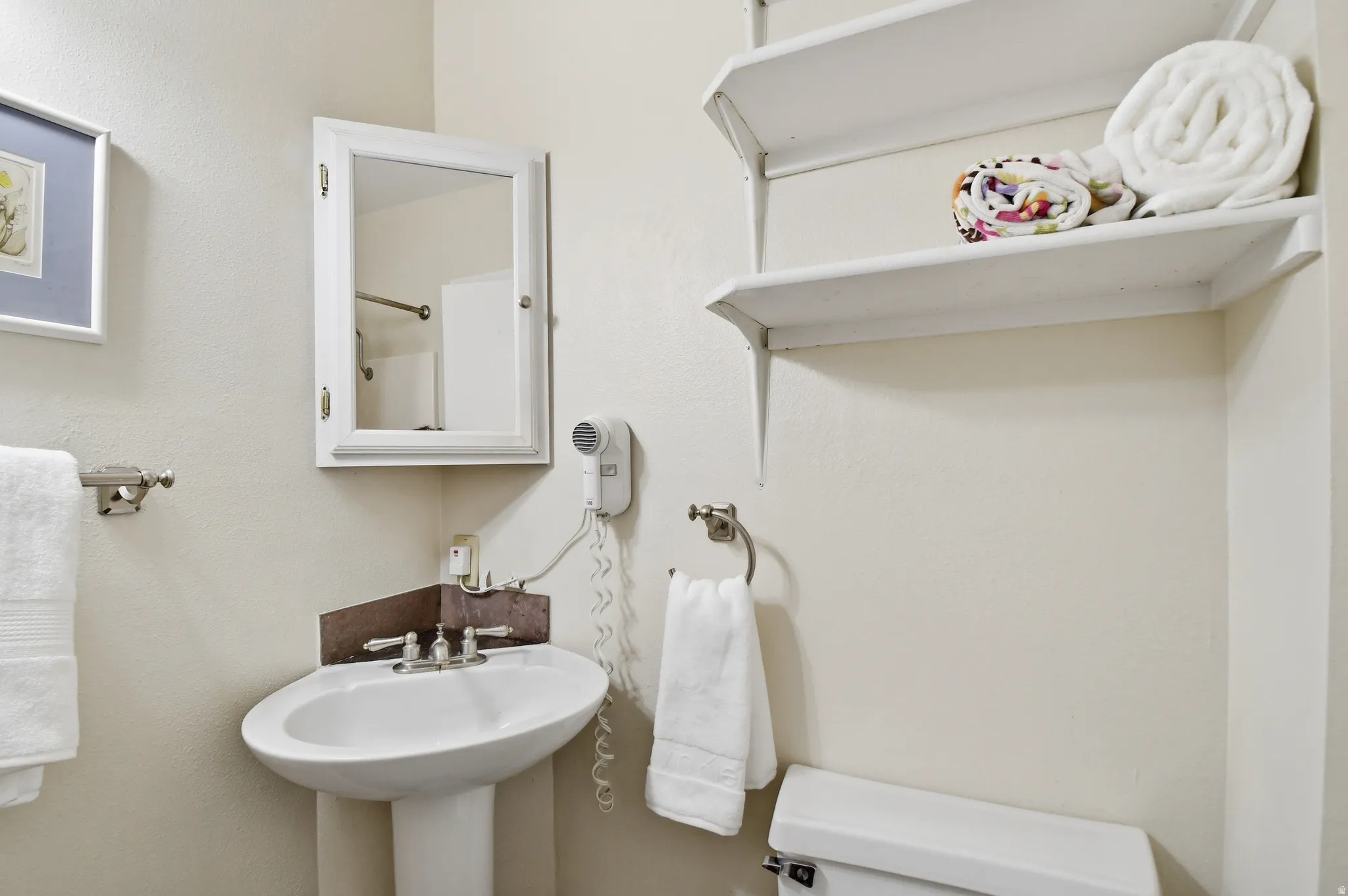Pedestal sink with dual-handle faucet