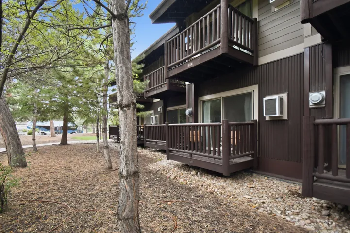 Multi-level residential building featuring private balconies and ground-floor patios