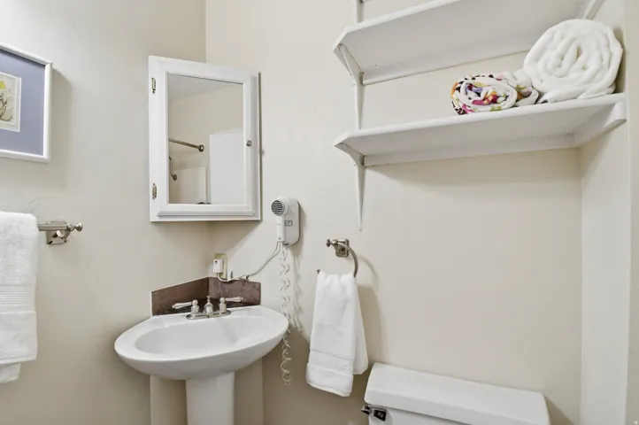 Pedestal sink with dual-handle faucet