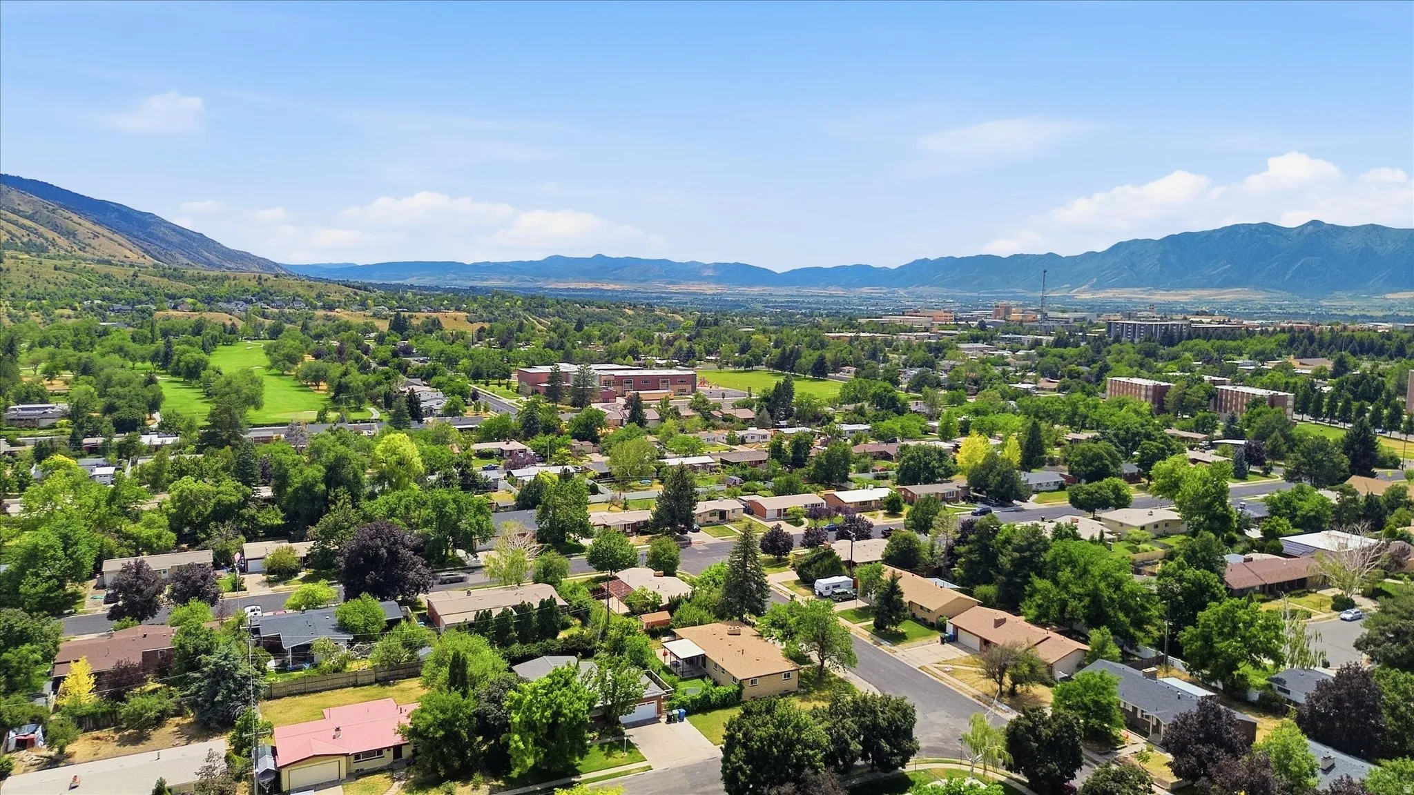 Expansive aerial perspective showcasing a residential area with varied housing styles