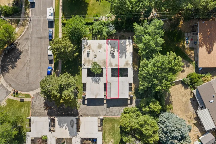 Duplex property with a flat roofline and integrated outdoor spaces