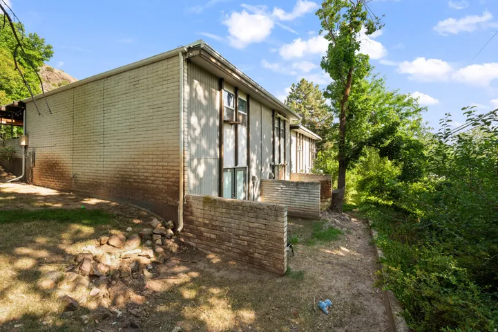 Exterior brick and vertical siding construction with multiple windows