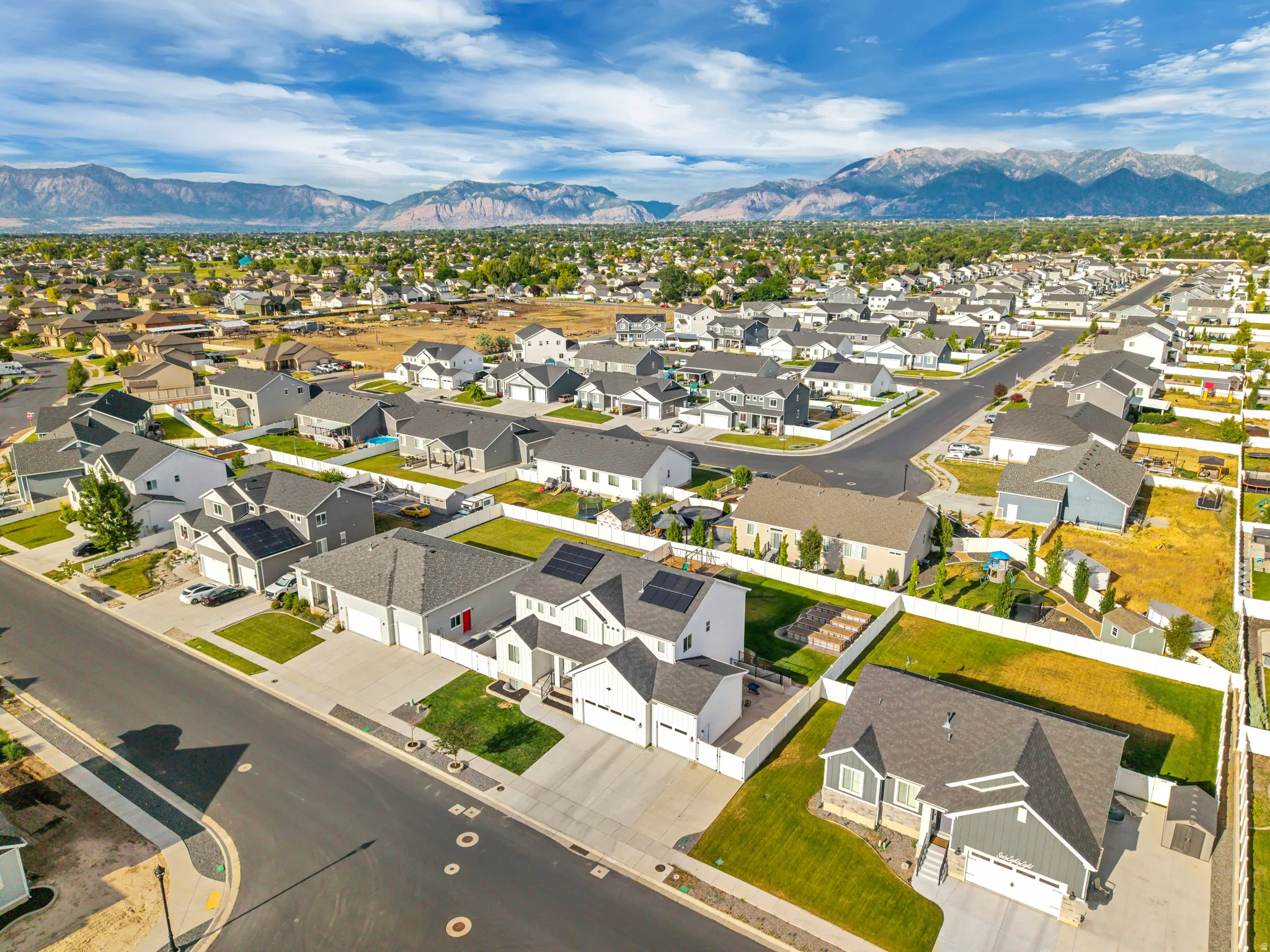 Expansive residential development with a backdrop of distant mountains
