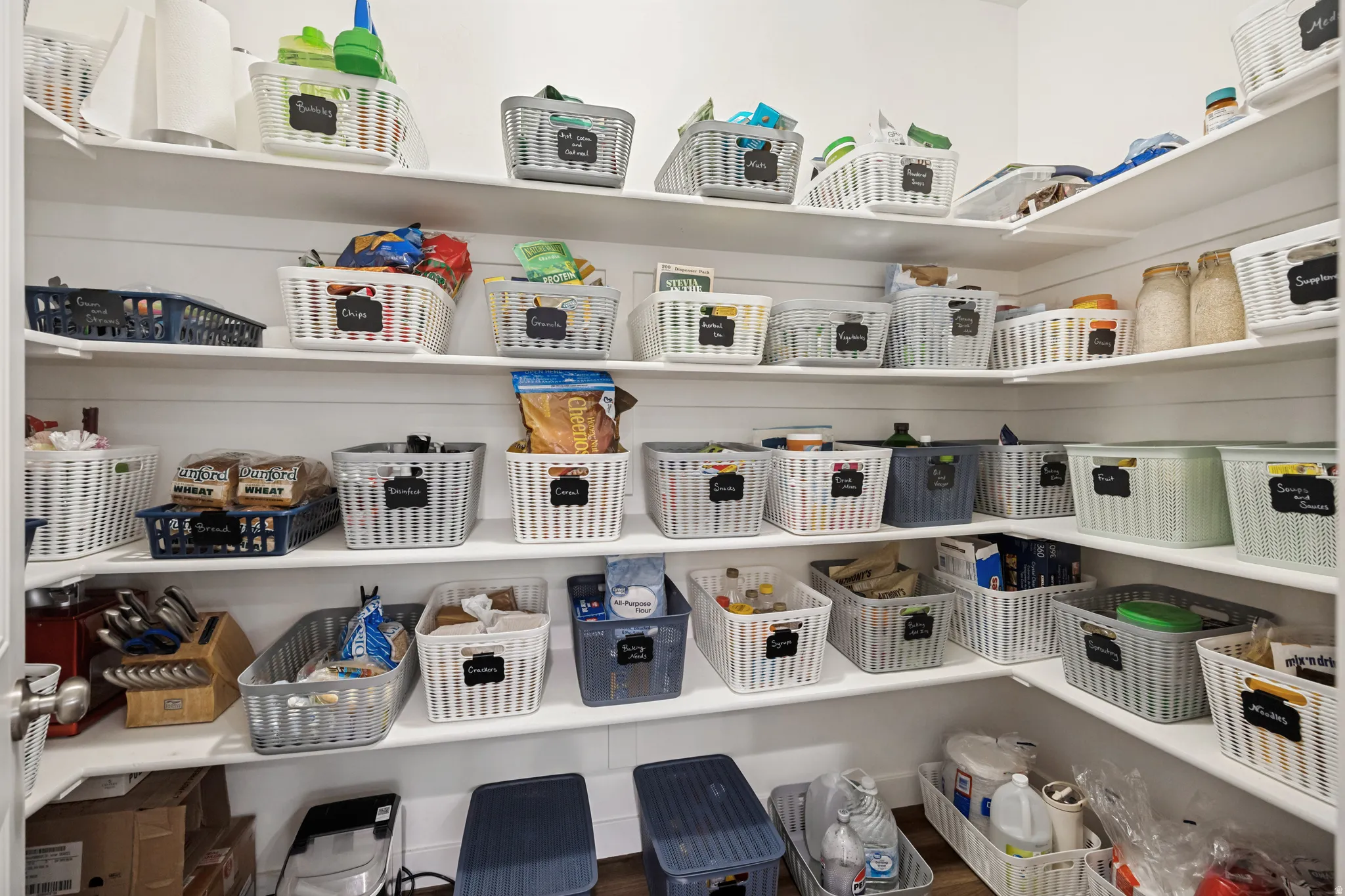 Custom pantry storage featuring multiple open shelves