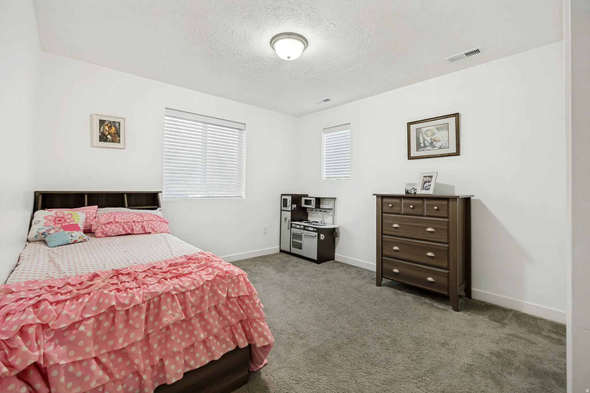 Room featuring neutral wall finishes and carpet flooring