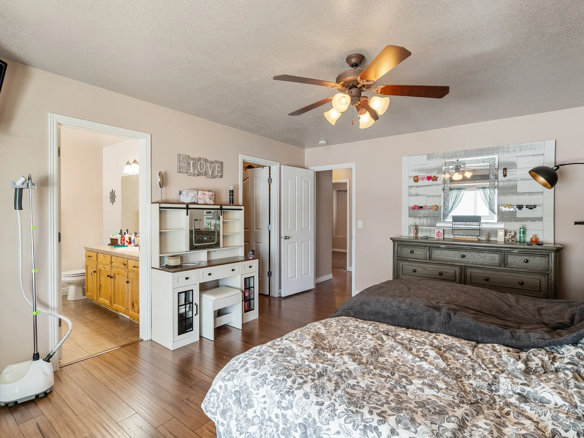 Wood-finish flooring throughout, with a recessed ceiling fan light fixture