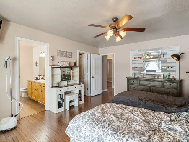 Wood-finish flooring throughout, with a recessed ceiling fan light fixture