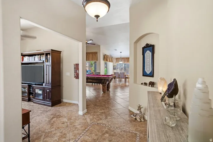 Tiled flooring with decorative inlay and arched wall niche