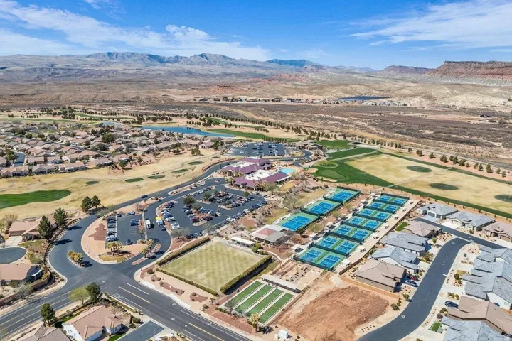 Aerial perspective showcasing a residential community with expansive golf course frontage