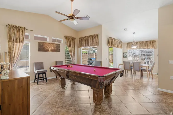 Spacious interior featuring vaulted ceilings and large format tile flooring