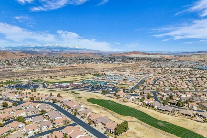 Aerial perspective showcasing a residential community with an integrated golf course