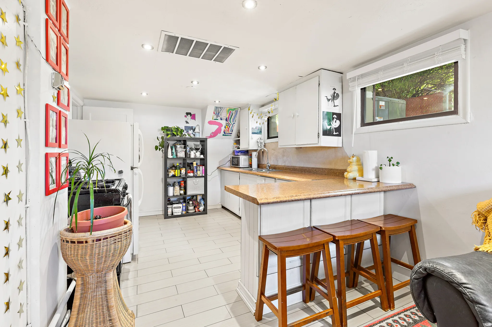 Kitchen with wood-finish flooring and recessed lighting