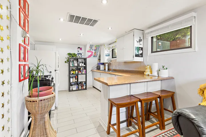 Kitchen with wood-finish flooring and recessed lighting
