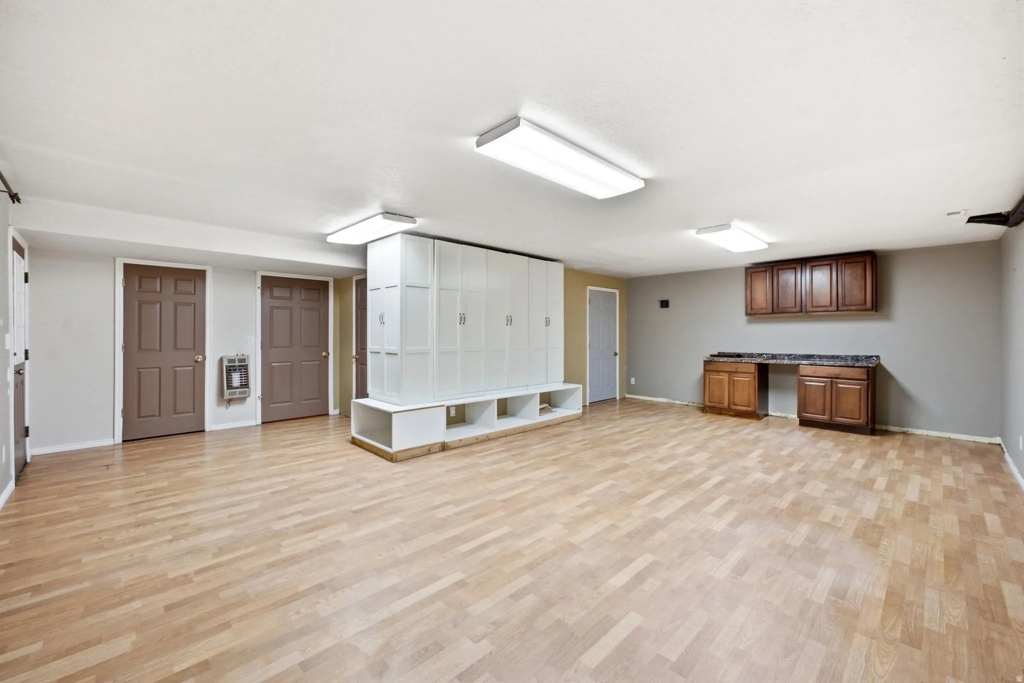Main home basement. Spacious room featuring light wood-finish flooring