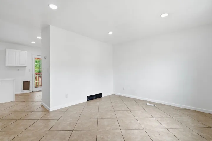Neutral-toned tile flooring throughout