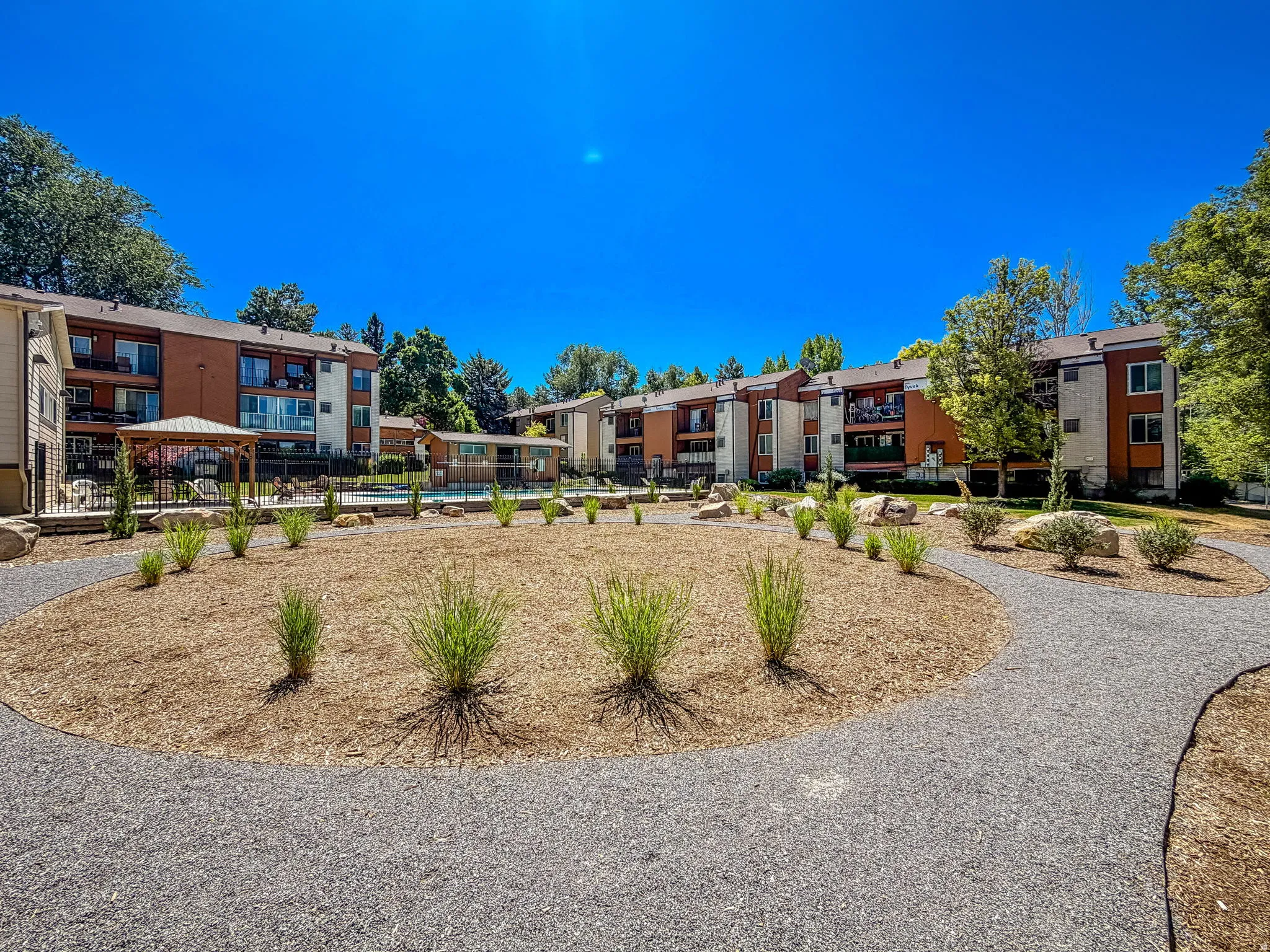 Exterior apartment buildings featuring private balconies and a neutral color palette